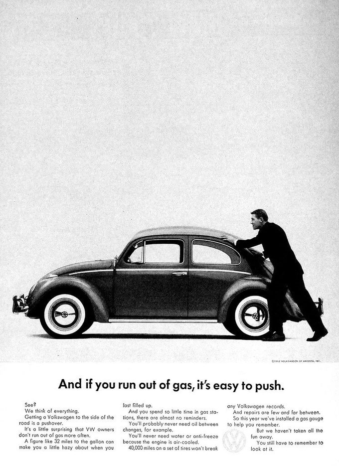 Classic Volkswagen Beetle print ad showing a man pushing the car, headlined ‘And if you run out of gas, it’s easy to push.’